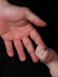 959971-close-up-of-baby-and-parents-hands-touching