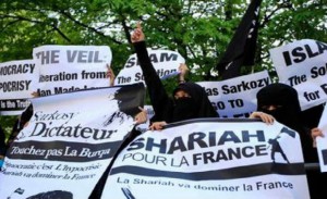 Burqa-clad women demonstrating in London against the French burqa ban