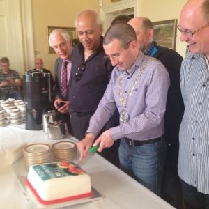 Cllr Andrew Muir campaigns for 'gay marriage' by cutting the 'QueerSpace' cake.