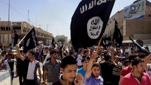 Pro-IS Muslims celebrate the anniversary of the capture of Mosul. Christians were forced to flee the town.