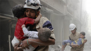White Helmets as they like to be seen, rescuing babies.