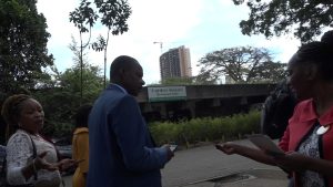 Judy Green hands out Christian Voice pro-life leaflets to delegates leaving the UNFPA Summit in Nairobi in November 2019.