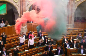 Opposition lawmakers lit flares in protest during the voting session.