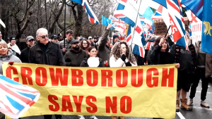 Residents in Crowborough object to migrants housed next door to them.