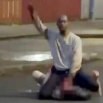 Hadi Alodid kneels over Stephen Ogilvie and attempts to behead him with a knife.