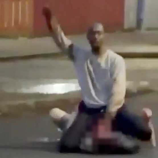 Hadi Alodid kneels over Stephen Ogilvie and attempts to behead him with a knife.