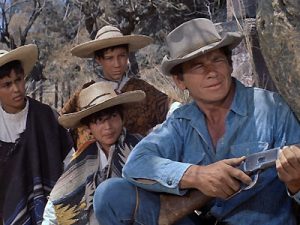 Charles Bronson's character in 'The Magnificent Seven' gives his life for the villagers.