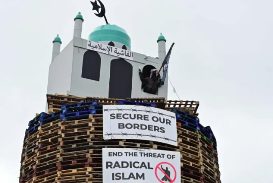 How NI’s replica mosque row exposes Britain’s double standards Northern Ireland man arrested for suspected hate crime after replica mosque placed on top of bonfire
